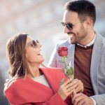 Guy gives girl a rose